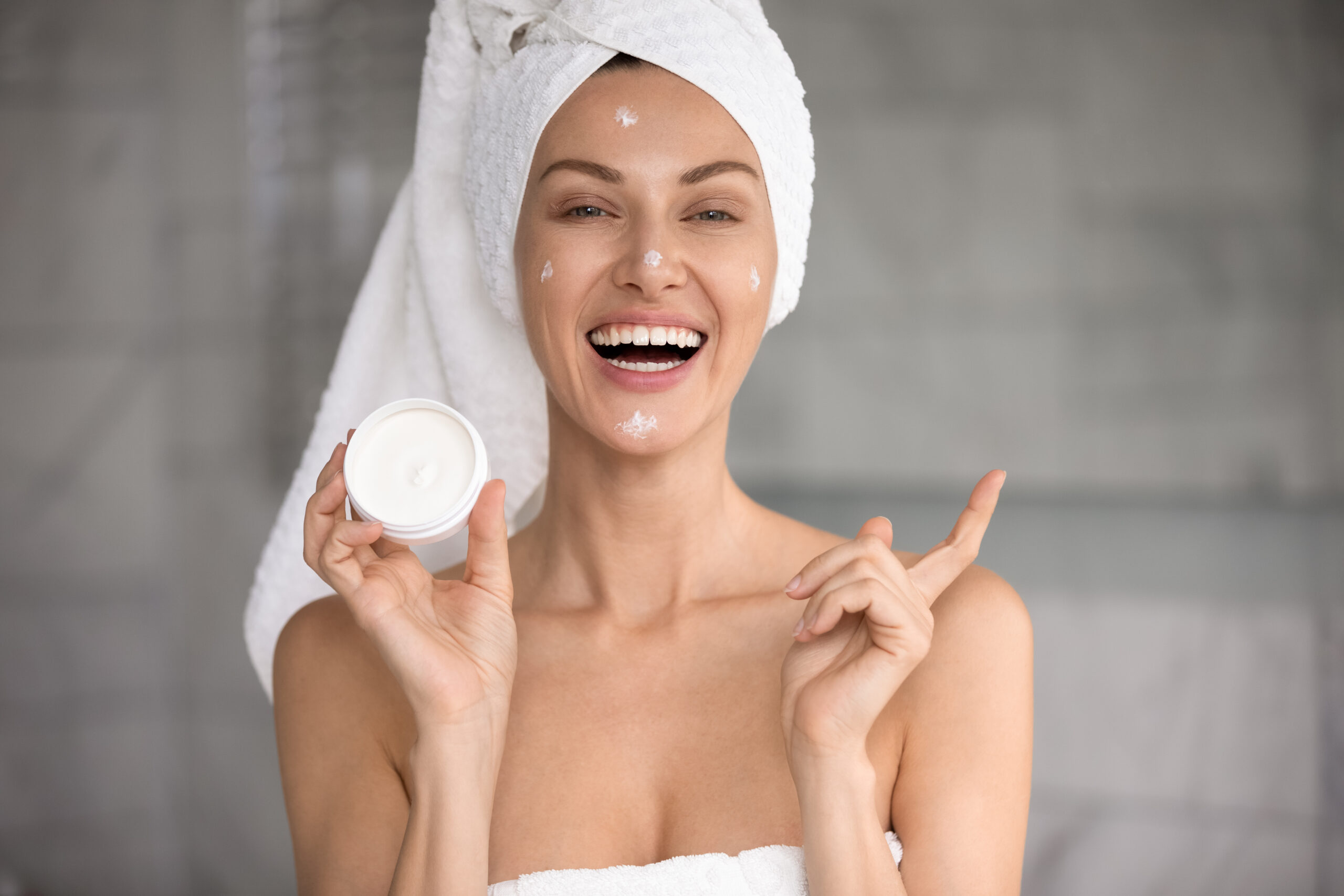 Image of natural skincare products in jars and bottles, representing cosmetic compliance and formulation services